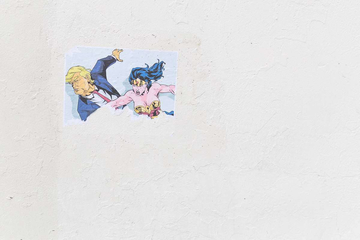 center street Wonder Woman and Donald Trump painting on white surface united states